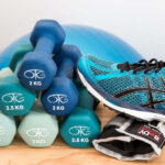 image of dumbbells, shoes and exercise equipment