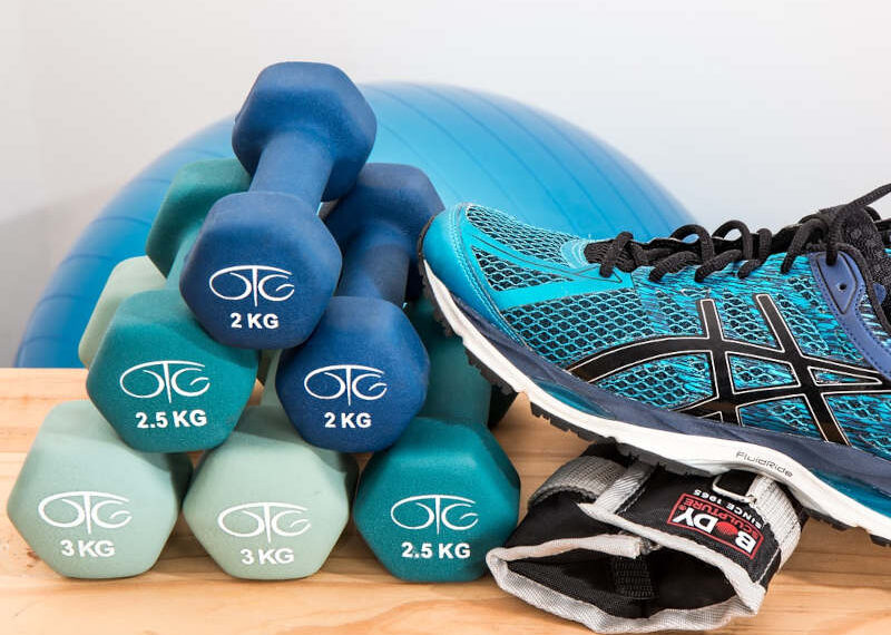 image of dumbbells, shoes and exercise equipment