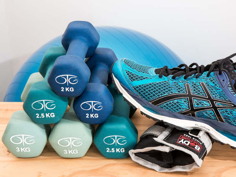 image of dumbbells, shoes and exercise equipment