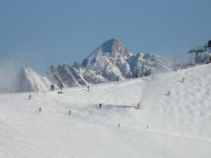 Image of people skiing on steeper mountain slope