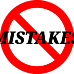 Image of the word 'mistakes' with the universal no symbol on it, representative of avoiding mistakes while buying mountain bike gear