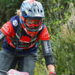 Image of a woman in her 60's mountain biking