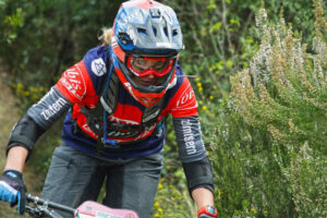 Image of a woman in her 60's mountain biking